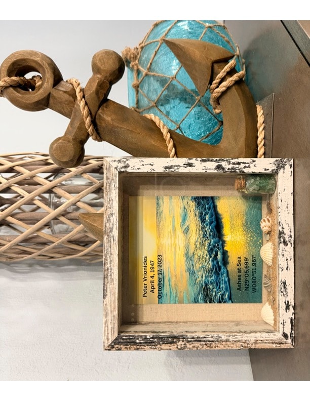 8x8 handcrafted memorial shadow box — burial at sea keepsake with green glass bottle, real Florida seashells, ocean scene, GPS coordinates, loved one's name and dates, and real beach sand — unique sympathy gift