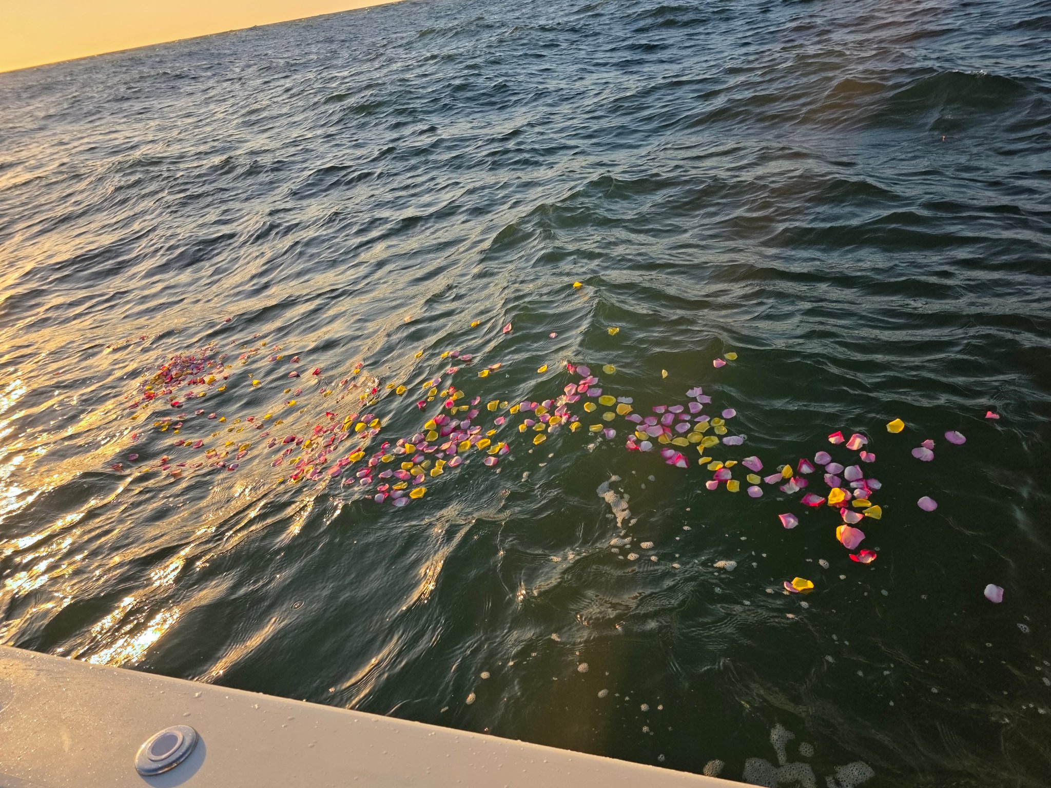 Family aboard boat for attended burial at sea ceremony in New Smyrna Beach, Florida